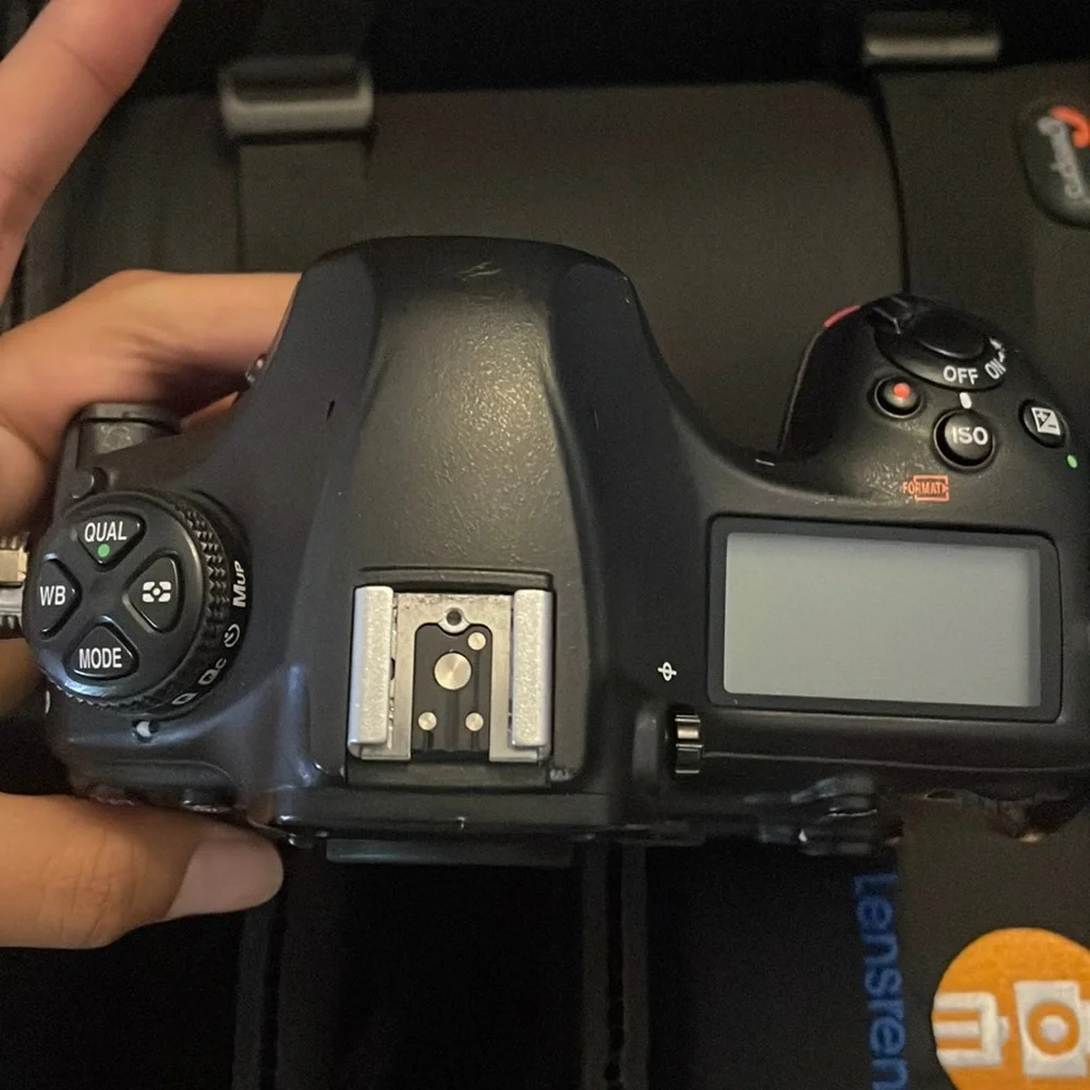 Nikon D850 digital black camera. With battery charger